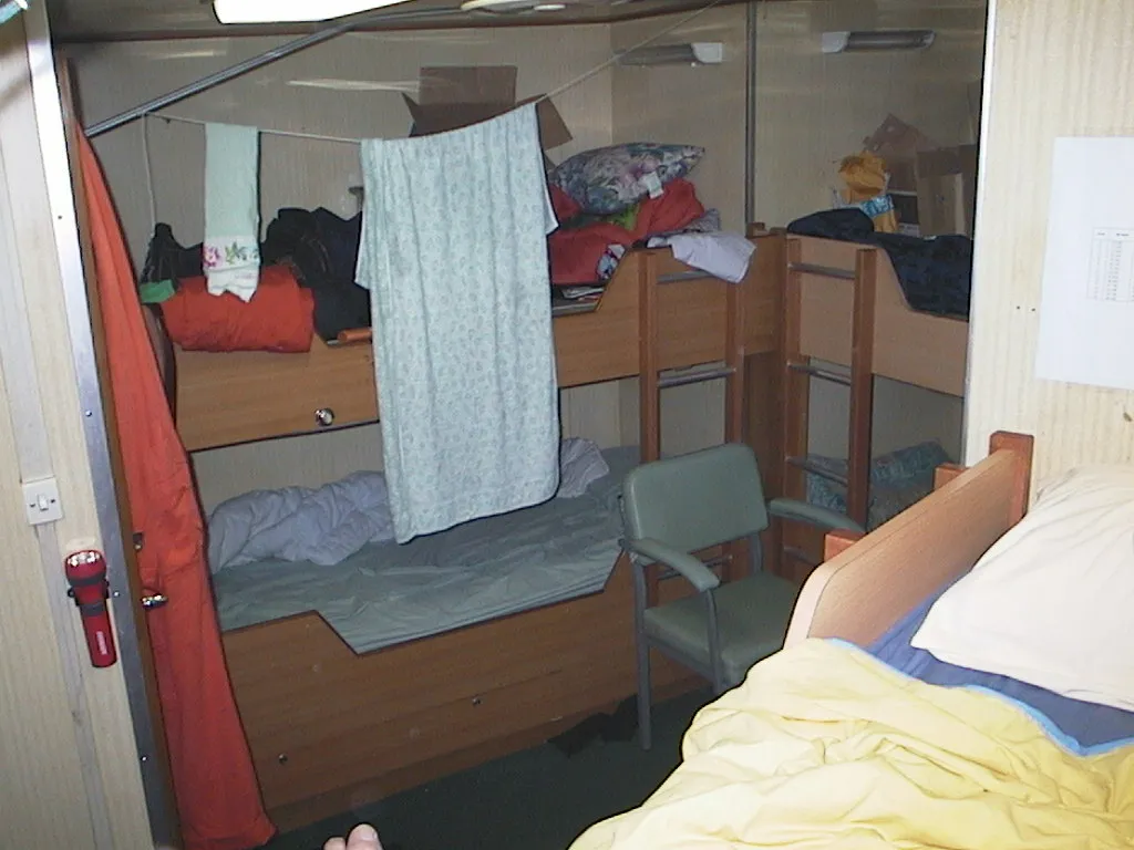 One room, four bunks, eight people on two opposing shifts.